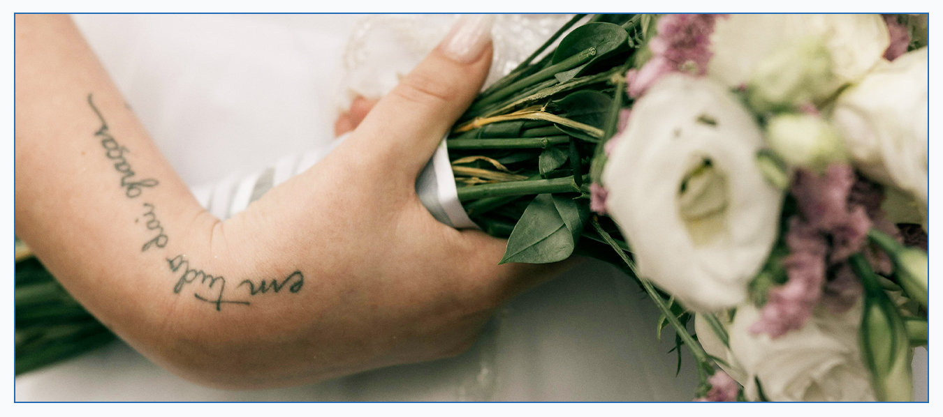 Bride showing forearm tattoo before laser tattoo removal session